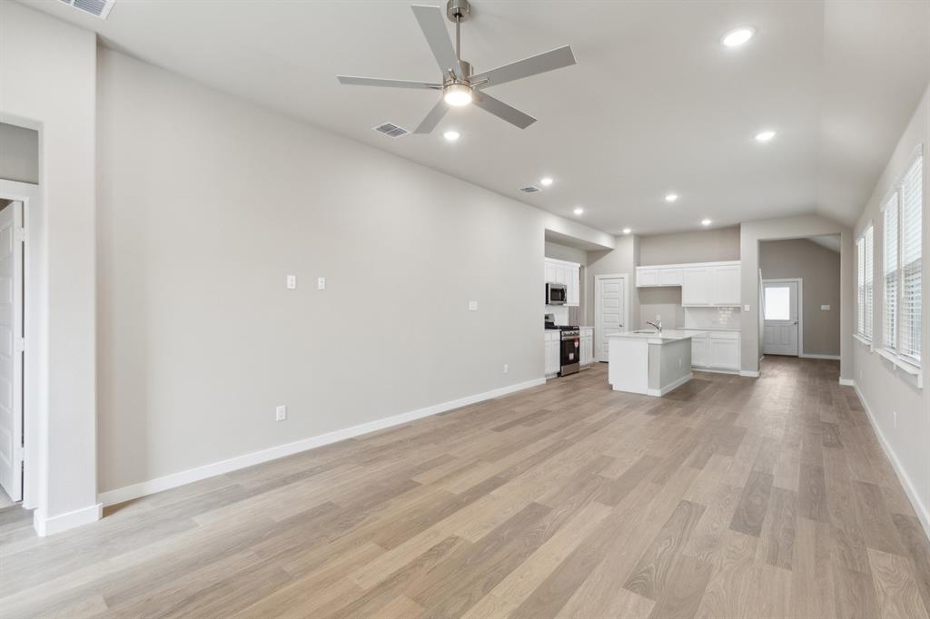 8356 Kingfisher Road Pilot Point, TX 76258 - Photo 12 of 32 Open living space in in the Elm home plan by Trophy Signature Homes – REPRESENTATIVE PHOTO