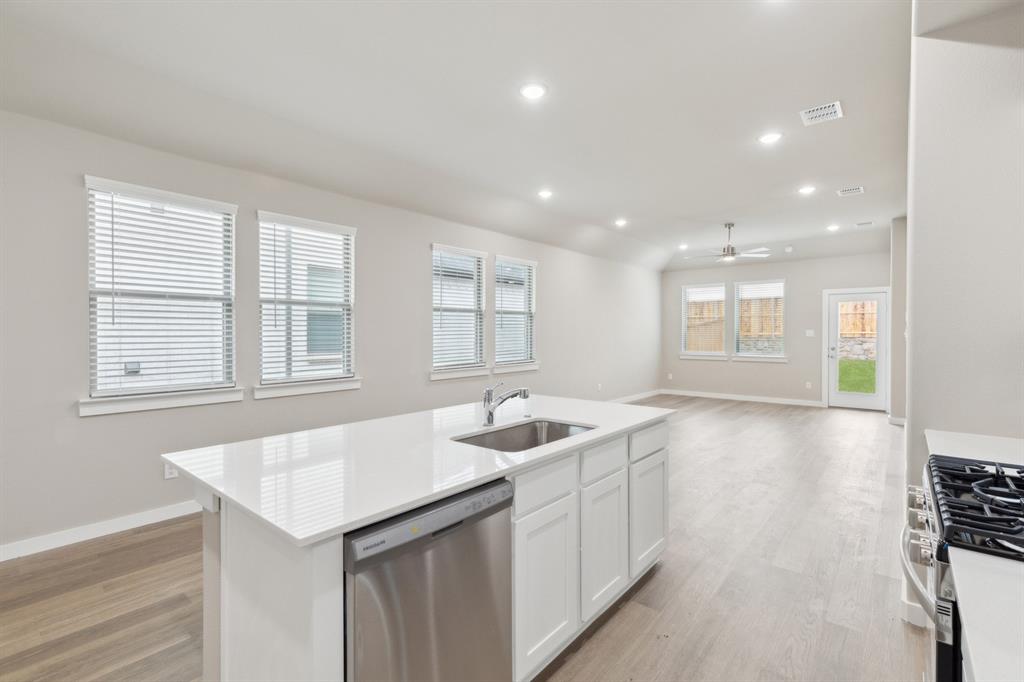 8356 Kingfisher Road Pilot Point, TX 76258 - Photo 13 of 32 Open living space in in the Elm home plan by Trophy Signature Homes – REPRESENTATIVE PHOTO