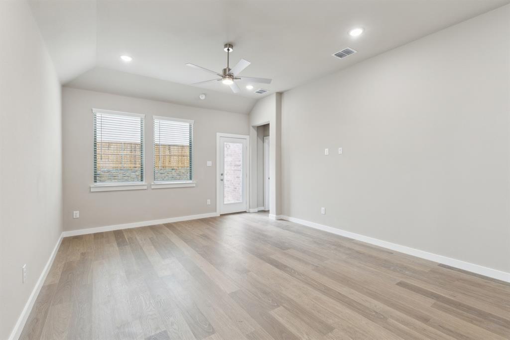 8356 Kingfisher Road Pilot Point, TX 76258 - Photo 16 of 32 Living room in in the Elm home plan by Trophy Signature Homes – REPRESENTATIVE PHOTO