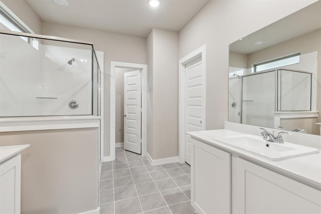 8356 Kingfisher Road Pilot Point, TX 76258 - Photo 19 of 32 Primary bathroom in the Elm home plan by Trophy Signature Homes – REPRESENTATIVE PHOTO