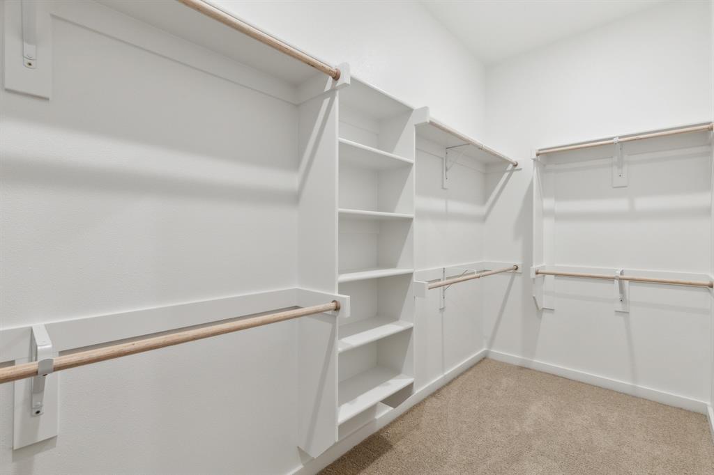 8356 Kingfisher Road Pilot Point, TX 76258 - Photo 22 of 32 Primary closet in the Elm home plan by Trophy Signature Homes – REPRESENTATIVE PHOTO