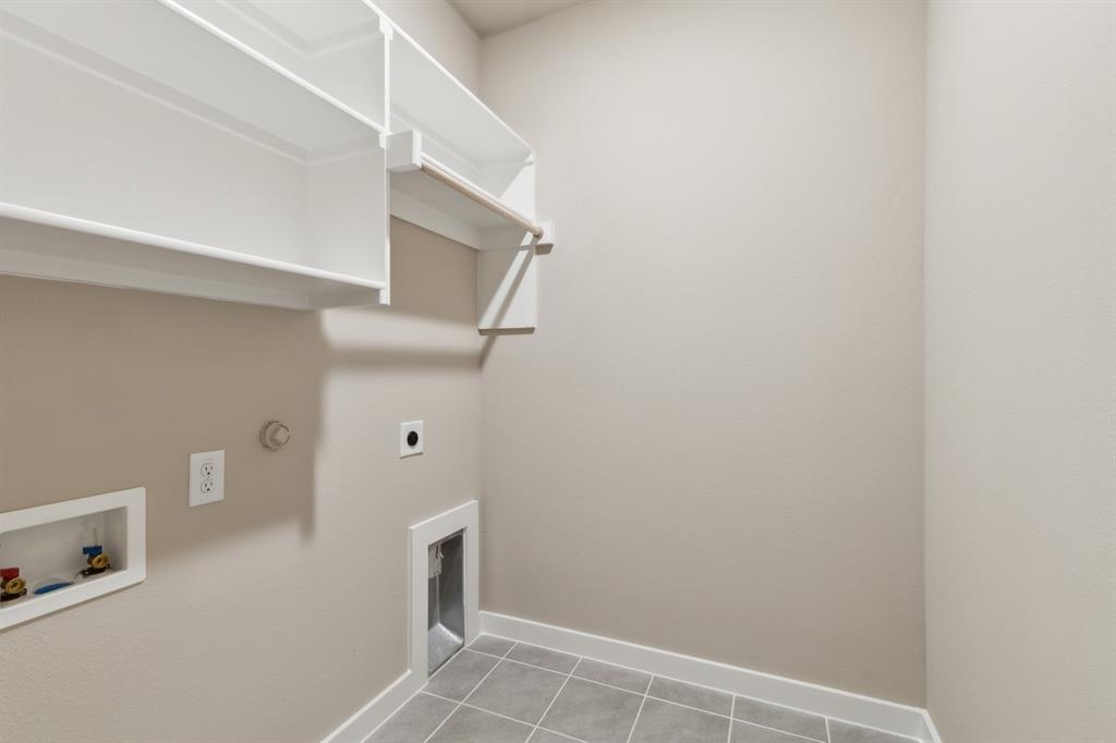 8356 Kingfisher Road Pilot Point, TX 76258 - Photo 26 of 32 Utility room in the Elm home plan by Trophy Signature Homes – REPRESENTATIVE PHOTO