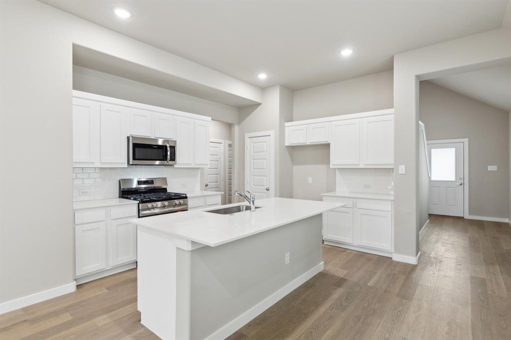 8356 Kingfisher Road Pilot Point, TX 76258 - Photo 6 of 32 Kitchen in the Elm home plan by Trophy Signature Homes – REPRESENTATIVE PHOTO