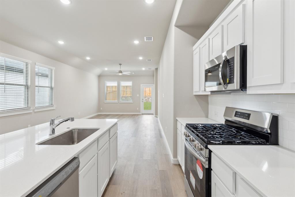 8356 Kingfisher Road Pilot Point, TX 76258 - Photo 8 of 32 Kitchen in the Elm home plan by Trophy Signature Homes – REPRESENTATIVE PHOTO