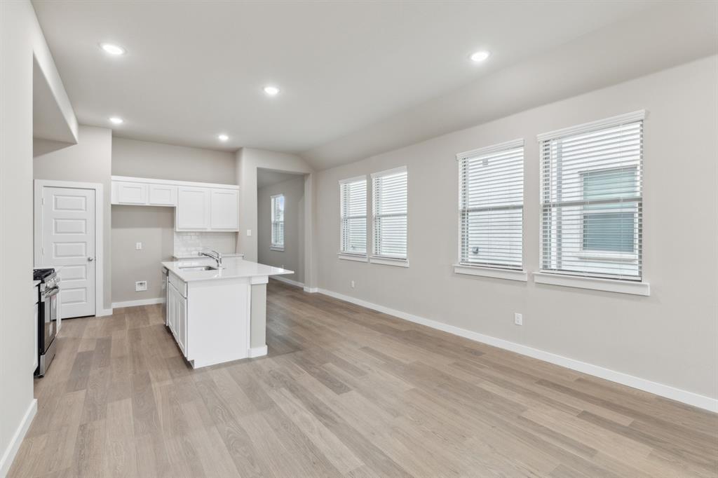 8356 Kingfisher Road Pilot Point, TX 76258 - Photo 9 of 32 Open living space in in the Elm home plan by Trophy Signature Homes – REPRESENTATIVE PHOTO