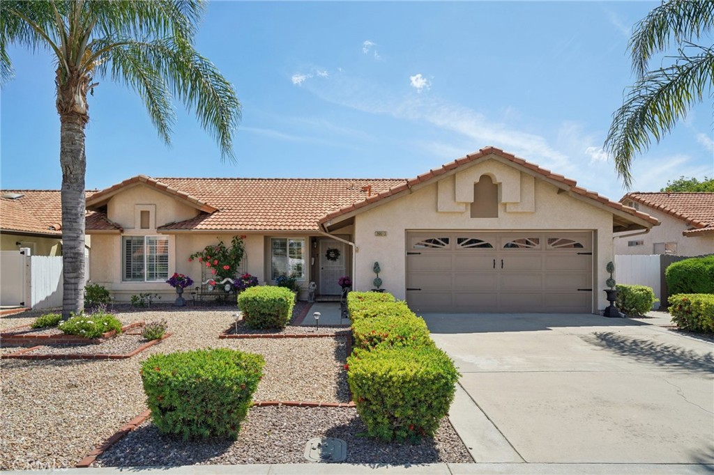 26613 Braddock Road Menifee, CA 92586 - Photo 1 of 1 a front view of a house with garden