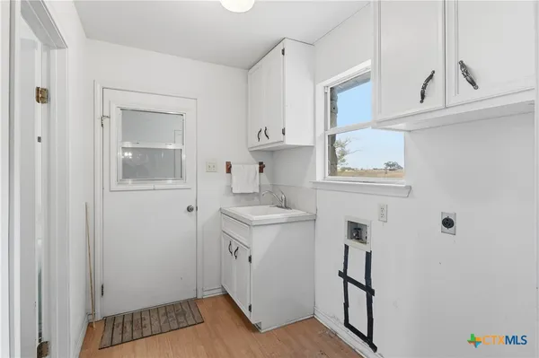 a bathroom with a sink a toilet and vanity