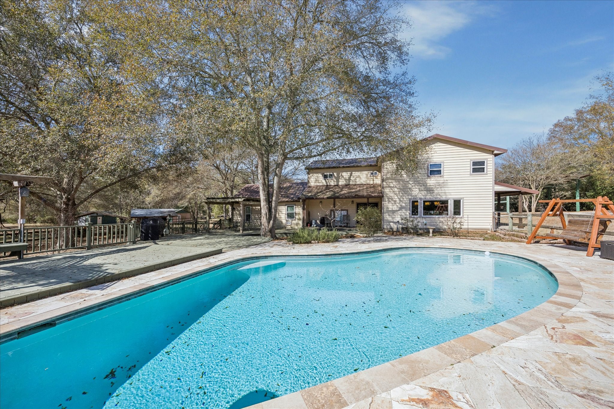 640 Piney Creek Road Bellville, TX 77418 - Photo 26 of 35 a view of a house with swimming pool and sitting area