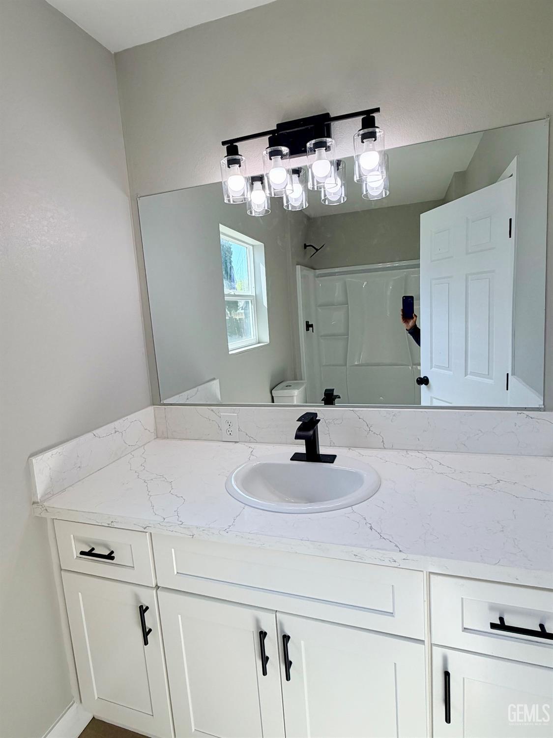 Undisclosed Address Wasco, CA 93280 - Photo 13 of 21 a bathroom with a sink vanity and mirror