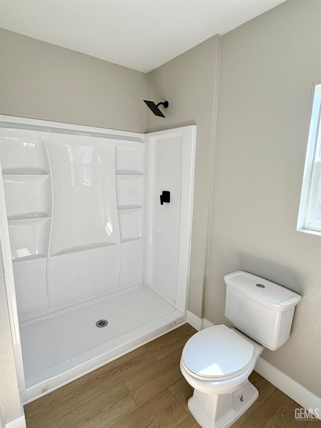 Undisclosed Address Wasco, CA 93280 - Photo 14 of 21 a bathroom with a toilet and a shower