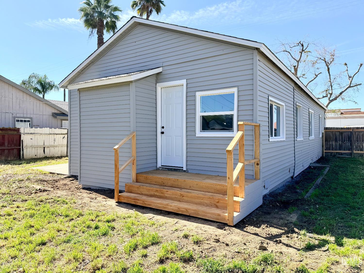 Undisclosed Address Wasco, CA 93280 - Photo 18 of 21 a view of a house with a yard