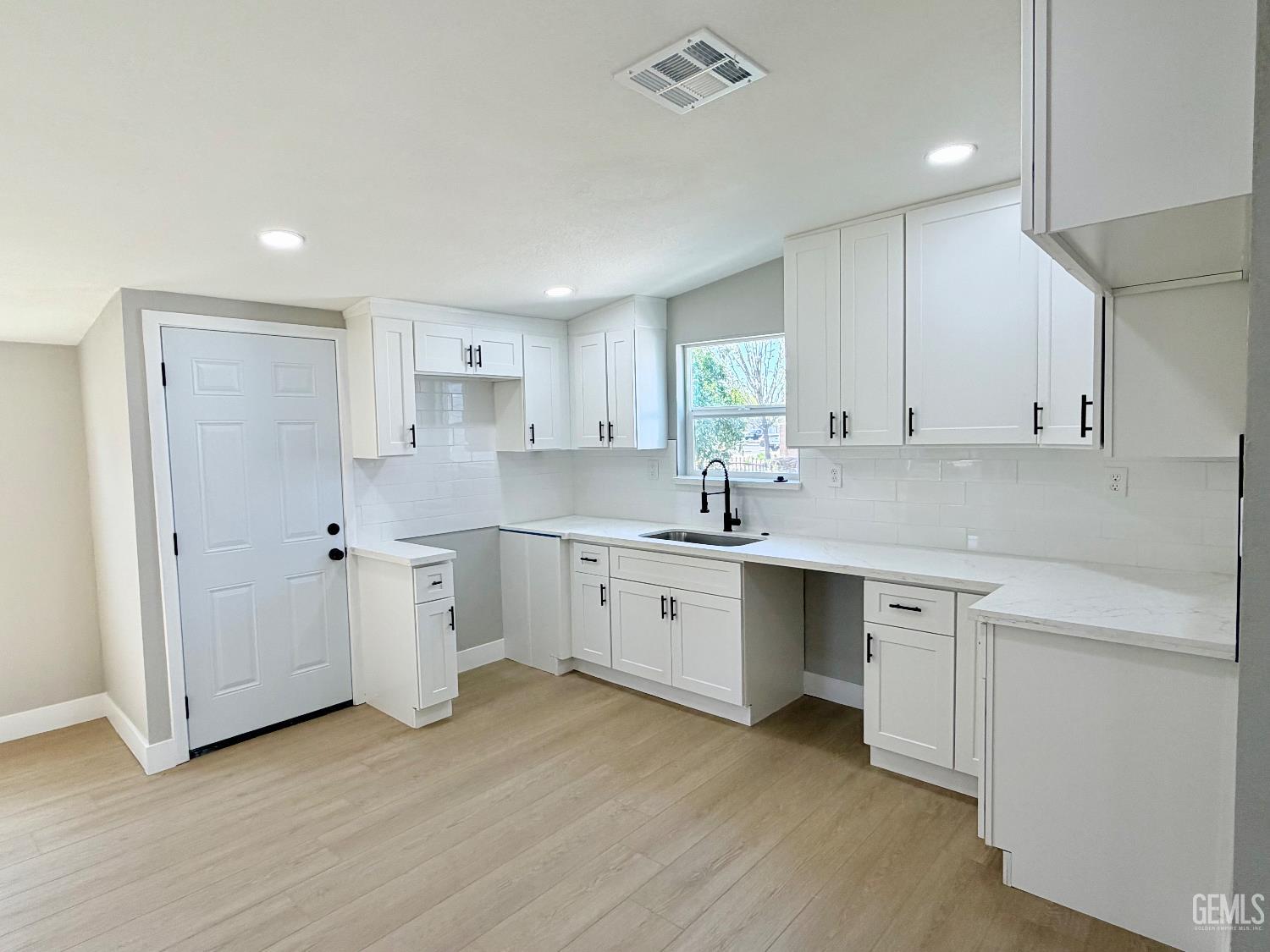 Undisclosed Address Wasco, CA 93280 - Photo 6 of 21 a kitchen with a sink cabinets and window
