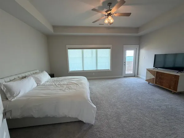a bathroom with a sink vanity mirror and toilet