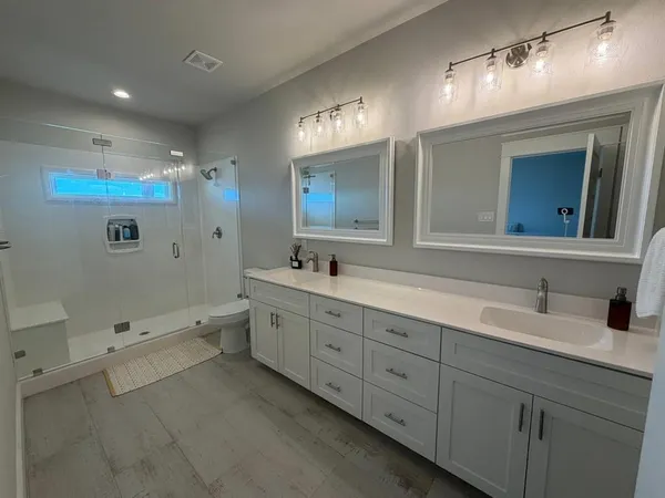a bathroom with a bathtub and a shower