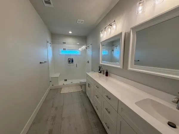 a bathroom with a shower and a toilet
