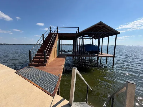 a swimming pool with a yard in front of it