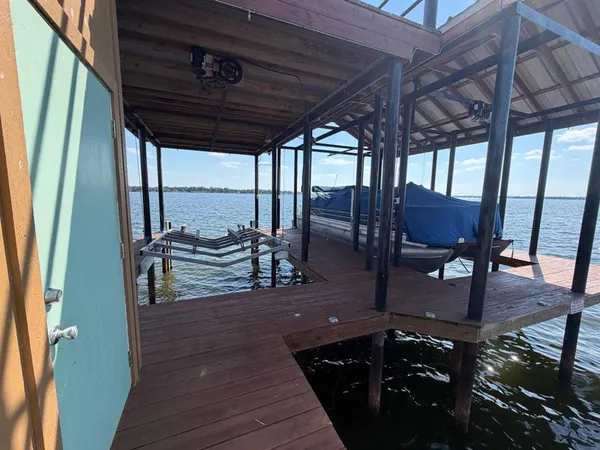 a terrace with outdoor seating and ocean view