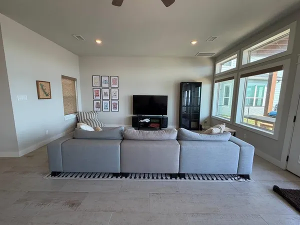 a kitchen with a refrigerator a stove a sink and white cabinets
