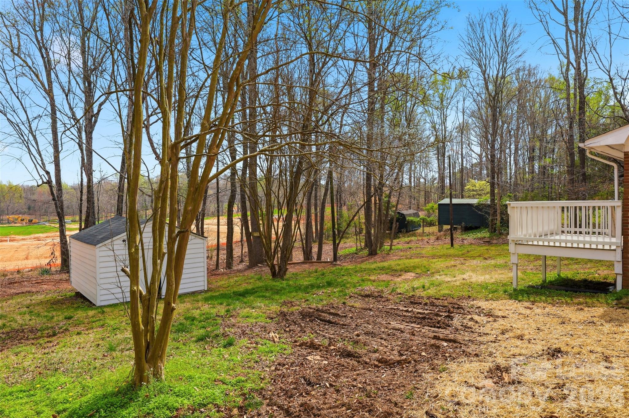 224 Yamasee Road Waxhaw, NC 28173 - Photo 16 of 22 a view of a backyard with large trees