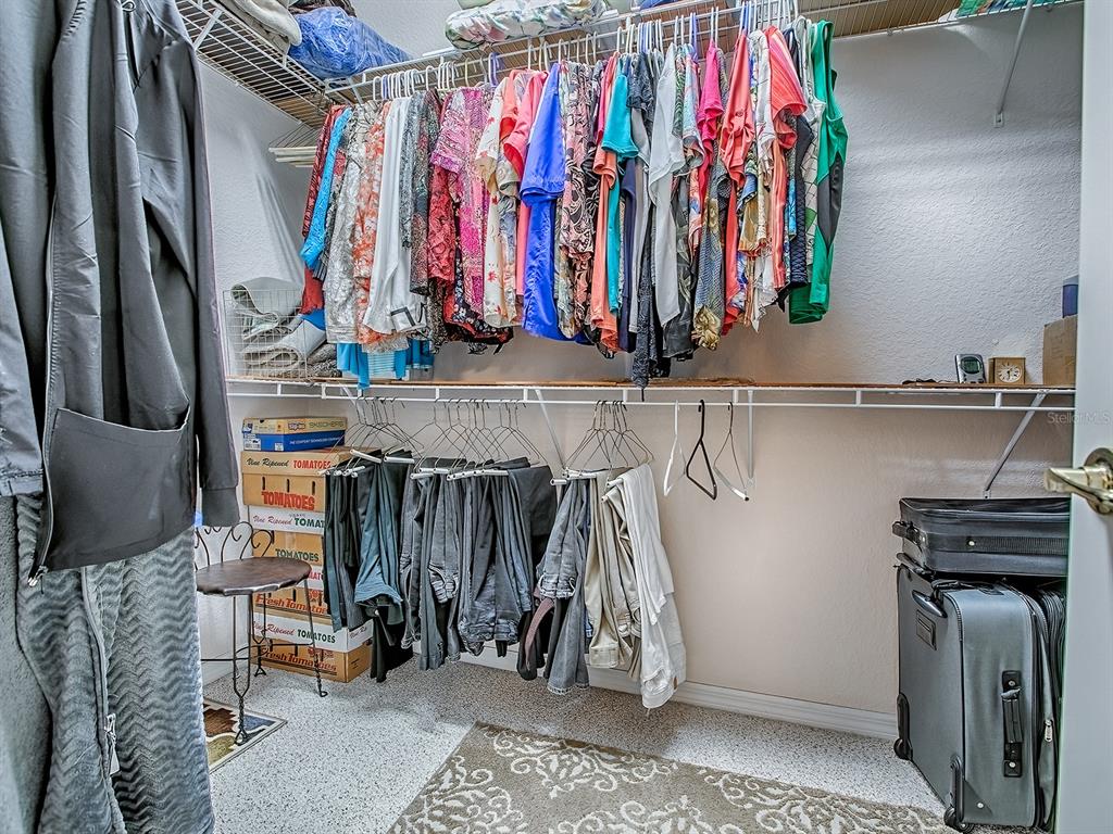 13324 Southeast 91st Court Road Summerfield, FL 34491 - Photo 28 of 46 a view of walk in closet with clothes