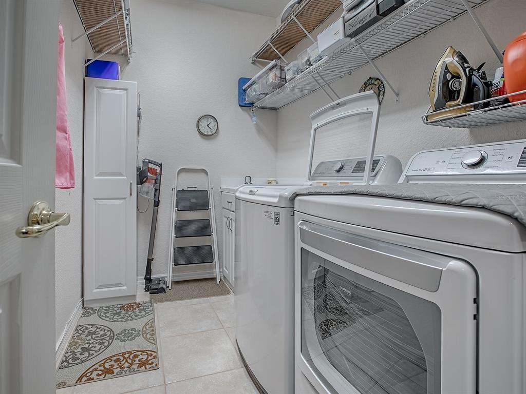 13324 Southeast 91st Court Road Summerfield, FL 34491 - Photo 29 of 46 a view of a utility room with closet dryer and washer