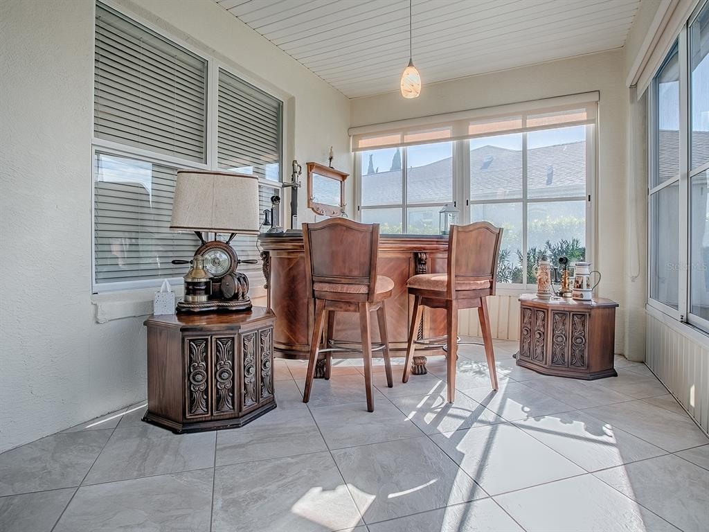 13324 Southeast 91st Court Road Summerfield, FL 34491 - Photo 31 of 46 a living room with furniture a large window and a chandelier