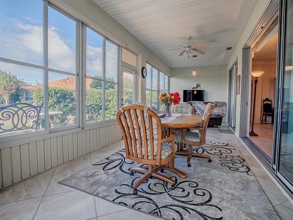 13324 Southeast 91st Court Road Summerfield, FL 34491 - Photo 32 of 46 a living room with furniture and a large window