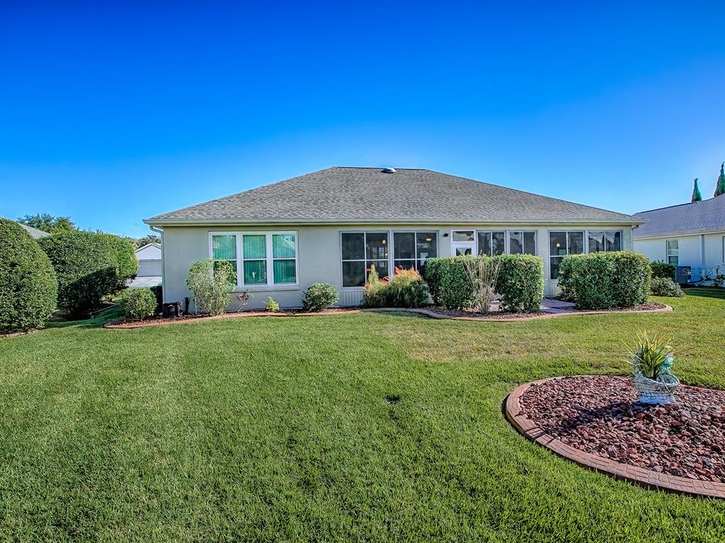 13324 Southeast 91st Court Road Summerfield, FL 34491 - Photo 39 of 46 a front view of a house with a yard