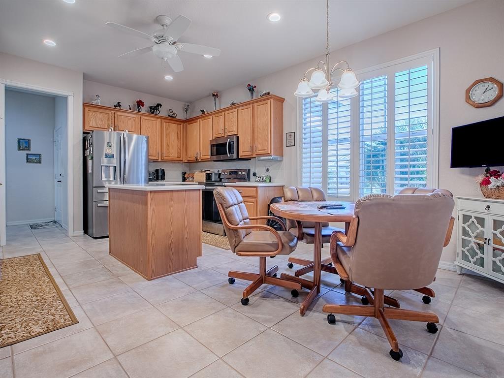13324 Southeast 91st Court Road Summerfield, FL 34491 - Photo 4 of 46 a view of a dining room with furniture and a window