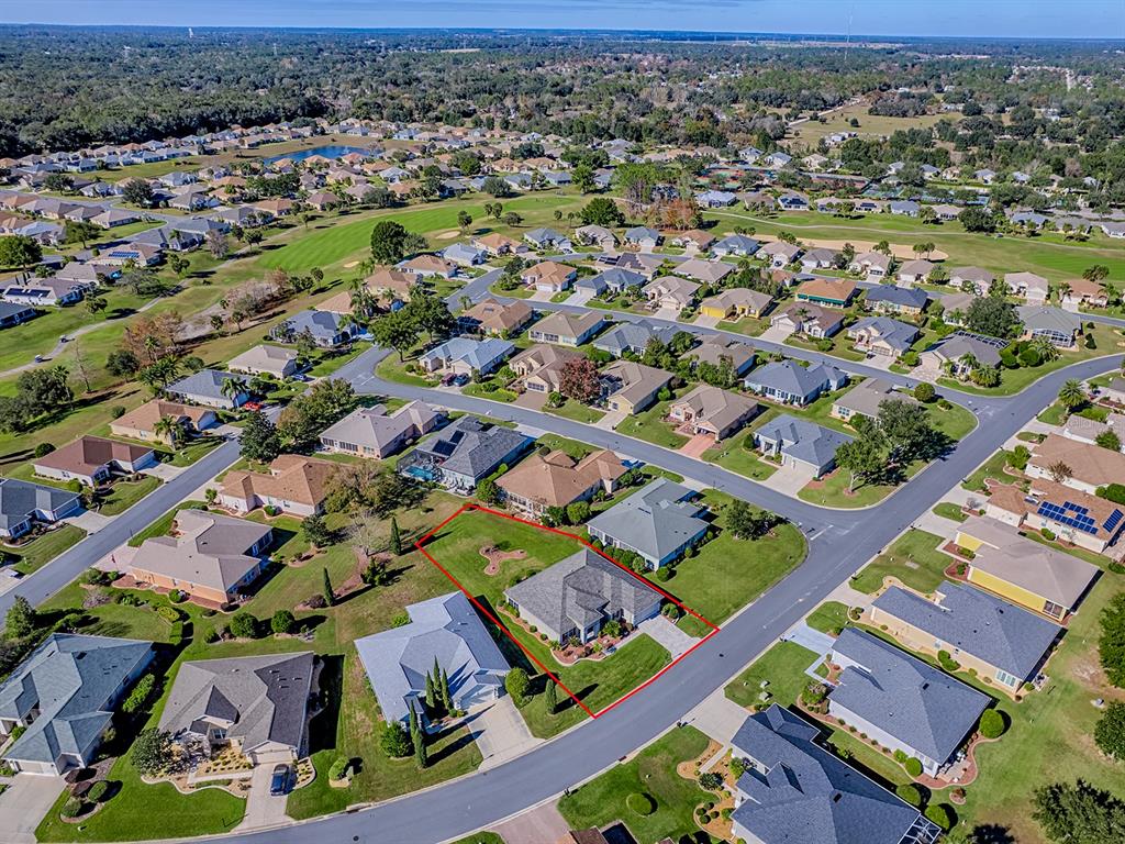 13324 Southeast 91st Court Road Summerfield, FL 34491 - Photo 45 of 46 an aerial view of residential houses with outdoor space