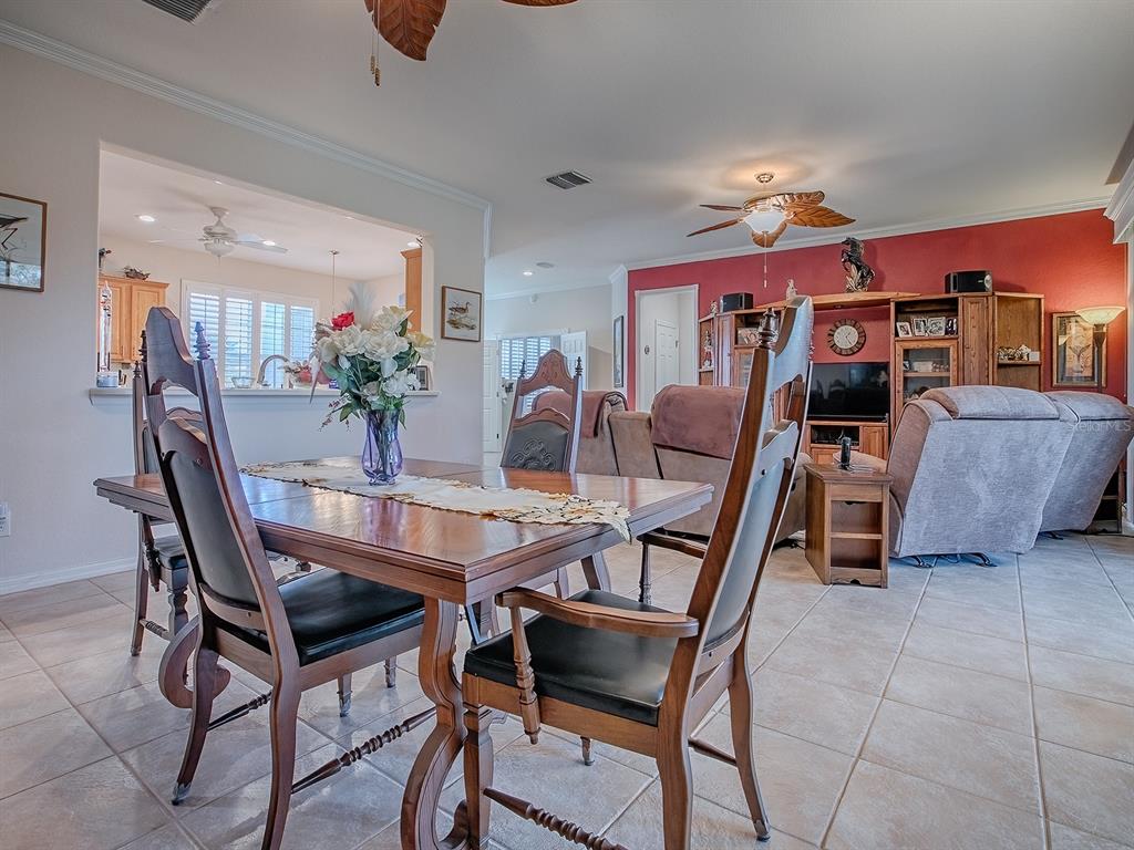13324 Southeast 91st Court Road Summerfield, FL 34491 - Photo 9 of 46 a view of a dining room with furniture