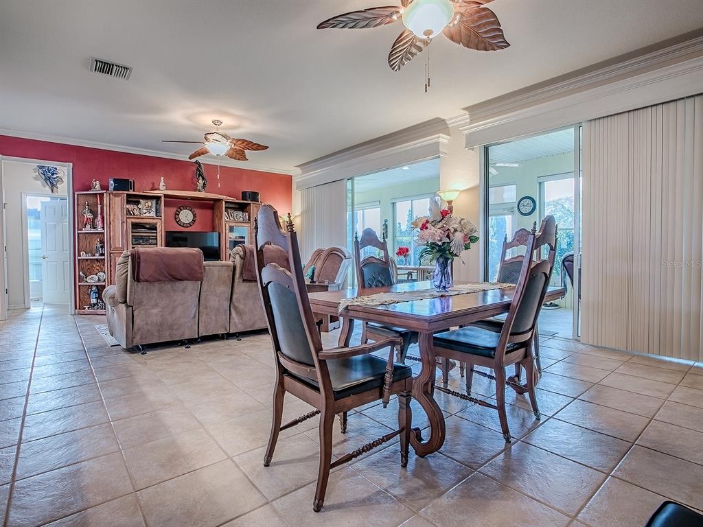 13324 Southeast 91st Court Road Summerfield, FL 34491 - Photo 10 of 46 a view of a dining room with furniture