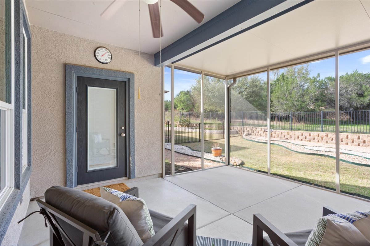 108 Cathedral Mountain Pass Georgetown, TX 78633 - Photo 31 of 36 a bedroom with a bed and a large window with the outer view