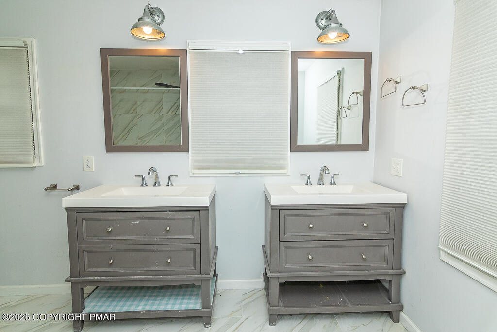 755 White Oak Road Cresco, PA 18326 - Photo 25 of 50 a bathroom with a sink and a mirror