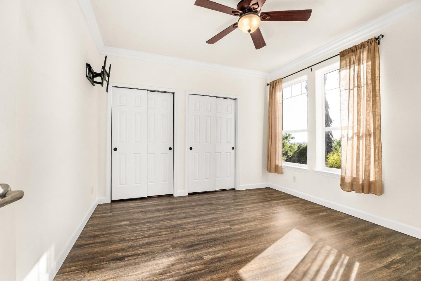960 Smith Road Watsonville, CA 95076 - Photo 36 of 53 a view of an empty room with wooden floor and a window