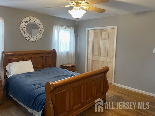 a bedroom with a bed and a mirror