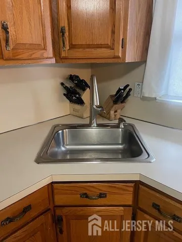 a kitchen with a stove and a sink