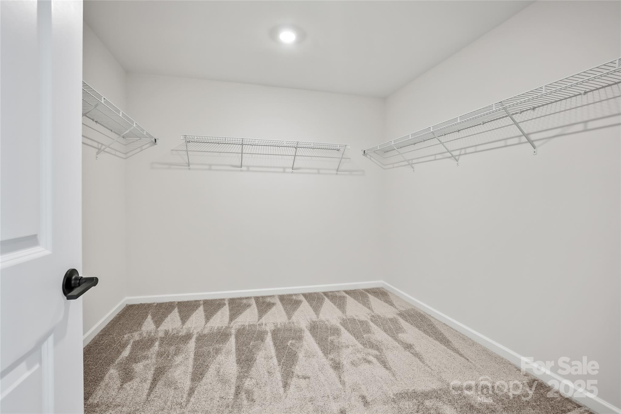 1821 Riverbend Avenue, Unit 85 Monroe, NC 28110 - Photo 13 of 15 a view of a room with racks on the wall