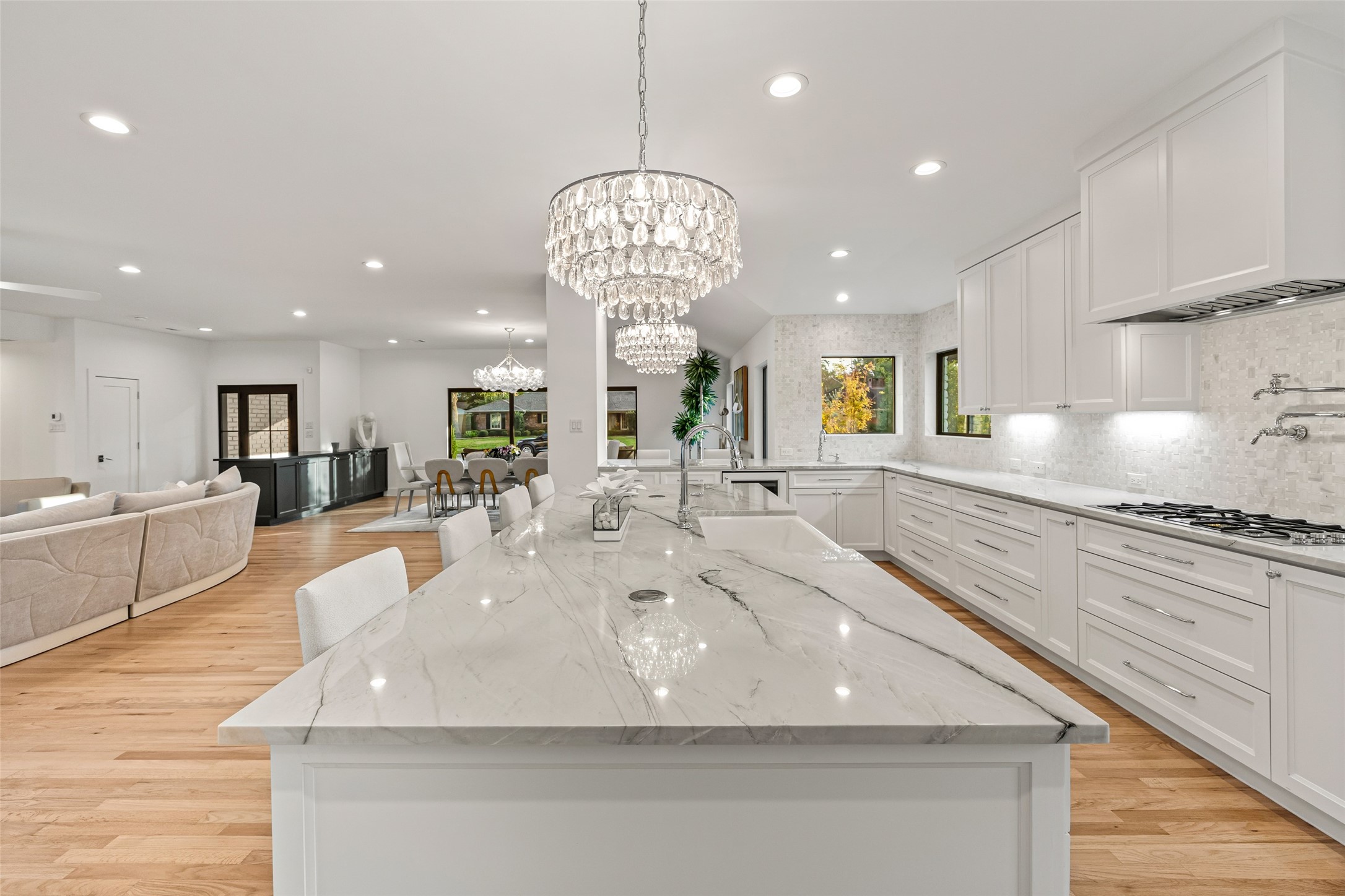 5658 Del Monte Drive Houston, TX 77056 - Photo 10 of 35 A chef-style kitchen with large walk-in pantry and butcher-block prep station
• Elegant living spaces designed for both everyday comfort and elevated entertaining
• Designer bathrooms with curated tilework, premium fixtures, and custom cabinetry
• Wide-format hardwood floors flowing throughout the home
• Massive backyard with endless possibilities—pool, guest house, sports court, or garden