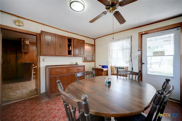 a view of a dining room with furniture window and outside view