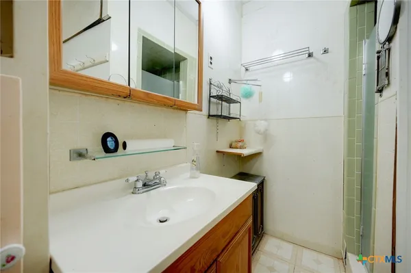 a bathroom with a sink and a mirror