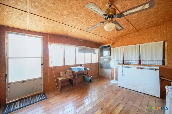 a room with furniture and wooden floor
