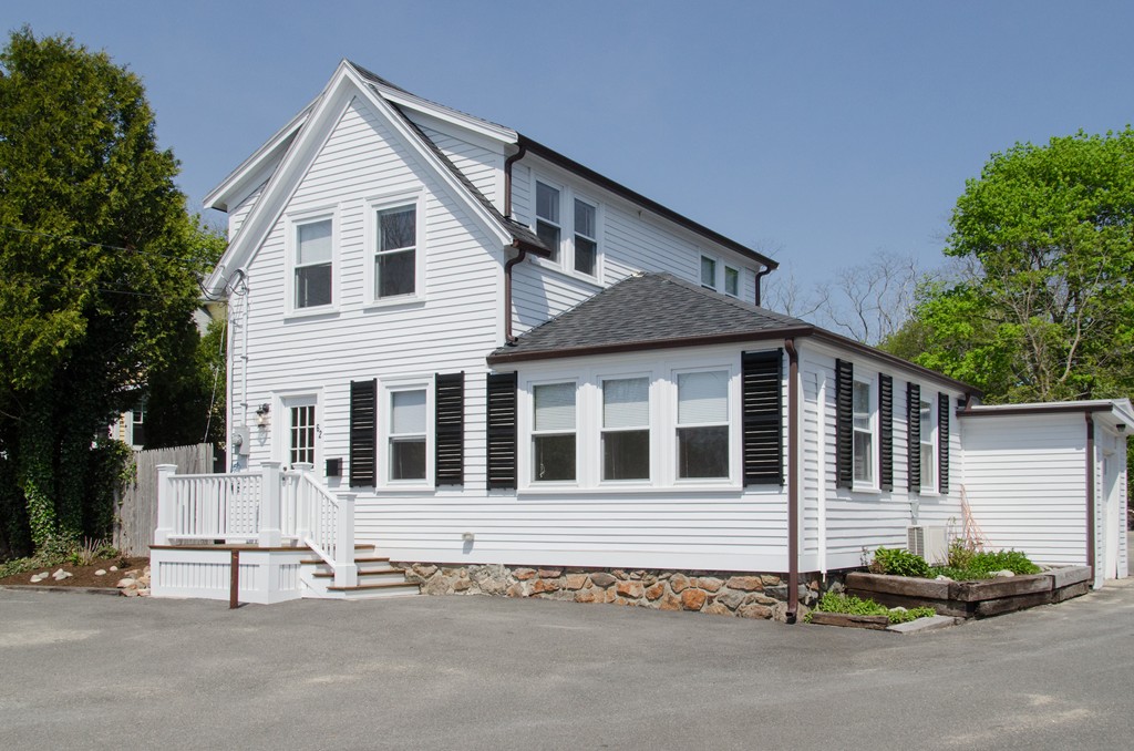 a house that has a large window in front of it
