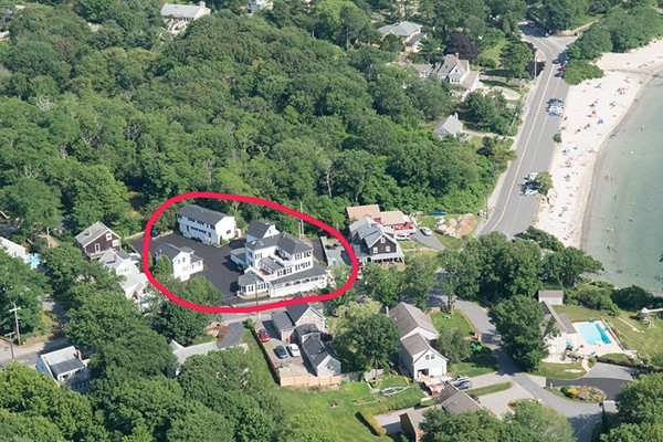 62 Eastern Point Road, Unit 1 Gloucester, MA 01930 - Photo 20 of 20 an aerial view of a house with a swimming pool and red chairs