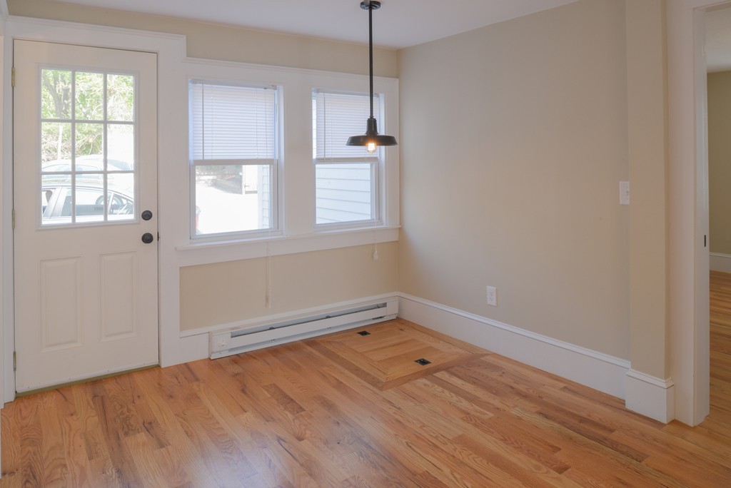62 Eastern Point Road, Unit 1 Gloucester, MA 01930 - Photo 6 of 20 a view of a room with wooden floor and window