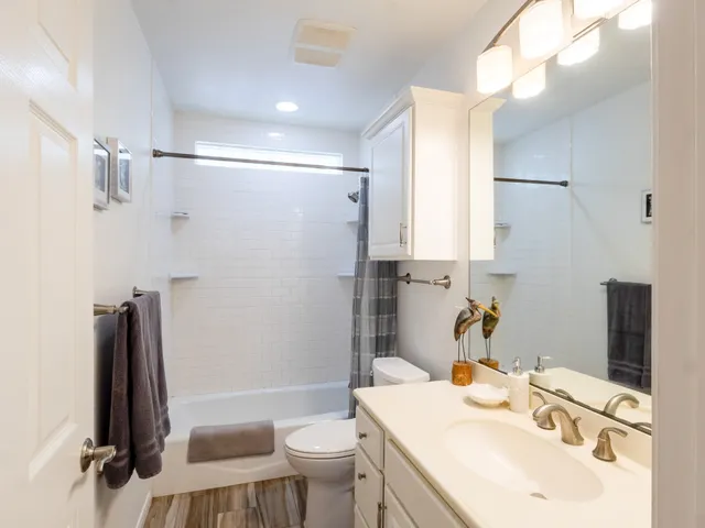 a bedroom with double bed and a window