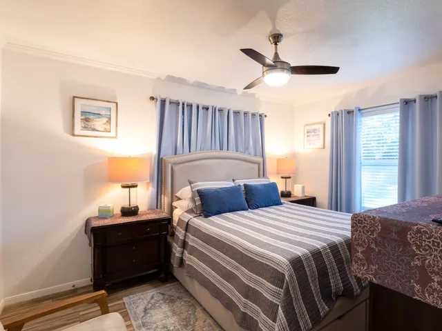 a bedroom with furniture and a window