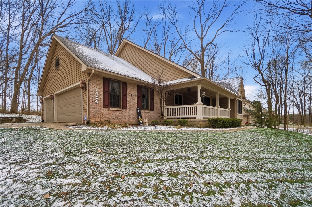 5300 Brookshire Lane Springfield, OH 45502 - Photo 4 of 56 This charming residence features an inviting front porch and a convenient attached garage.