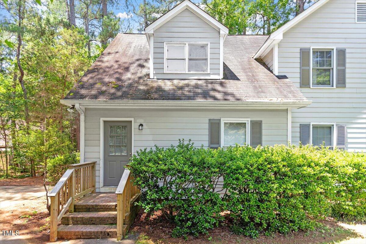 9 Tarawa Terrace, Unit A Durham, NC 27705 - Photo 1 of 12 a front view of a house with a yard