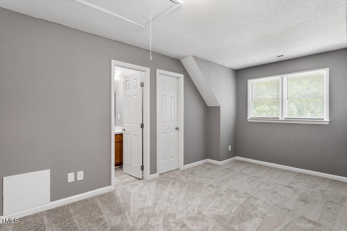 9 Tarawa Terrace, Unit A Durham, NC 27705 - Photo 7 of 12 a view of an empty room with a window
